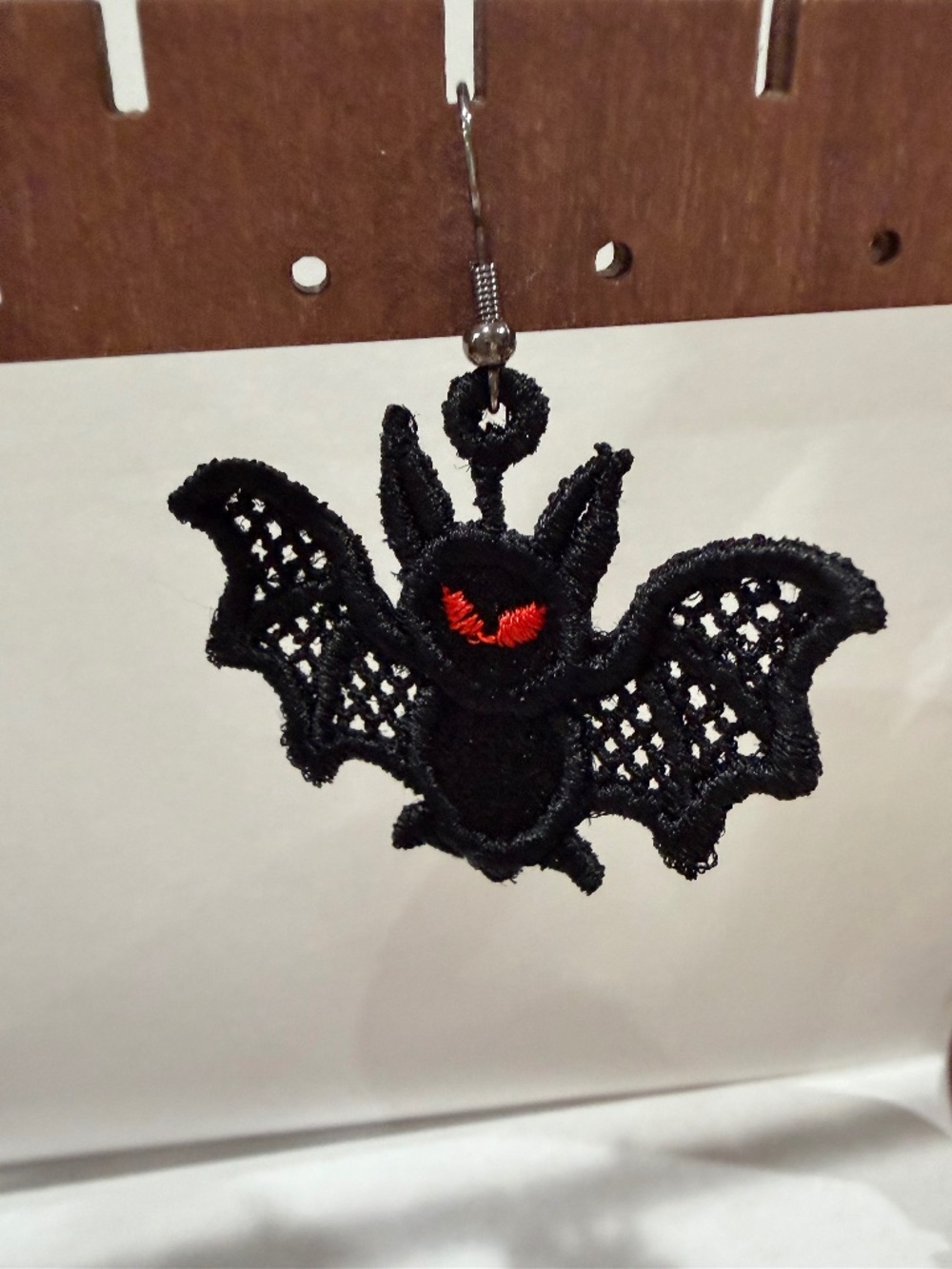 Small embroidered bat earrings